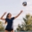 Volleyball player practicing an overhand serve toss