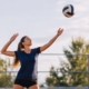 Volleyball player practicing an overhand serve toss